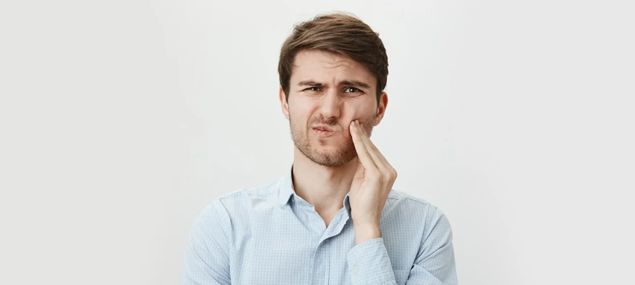 girl touching her healthy teeth